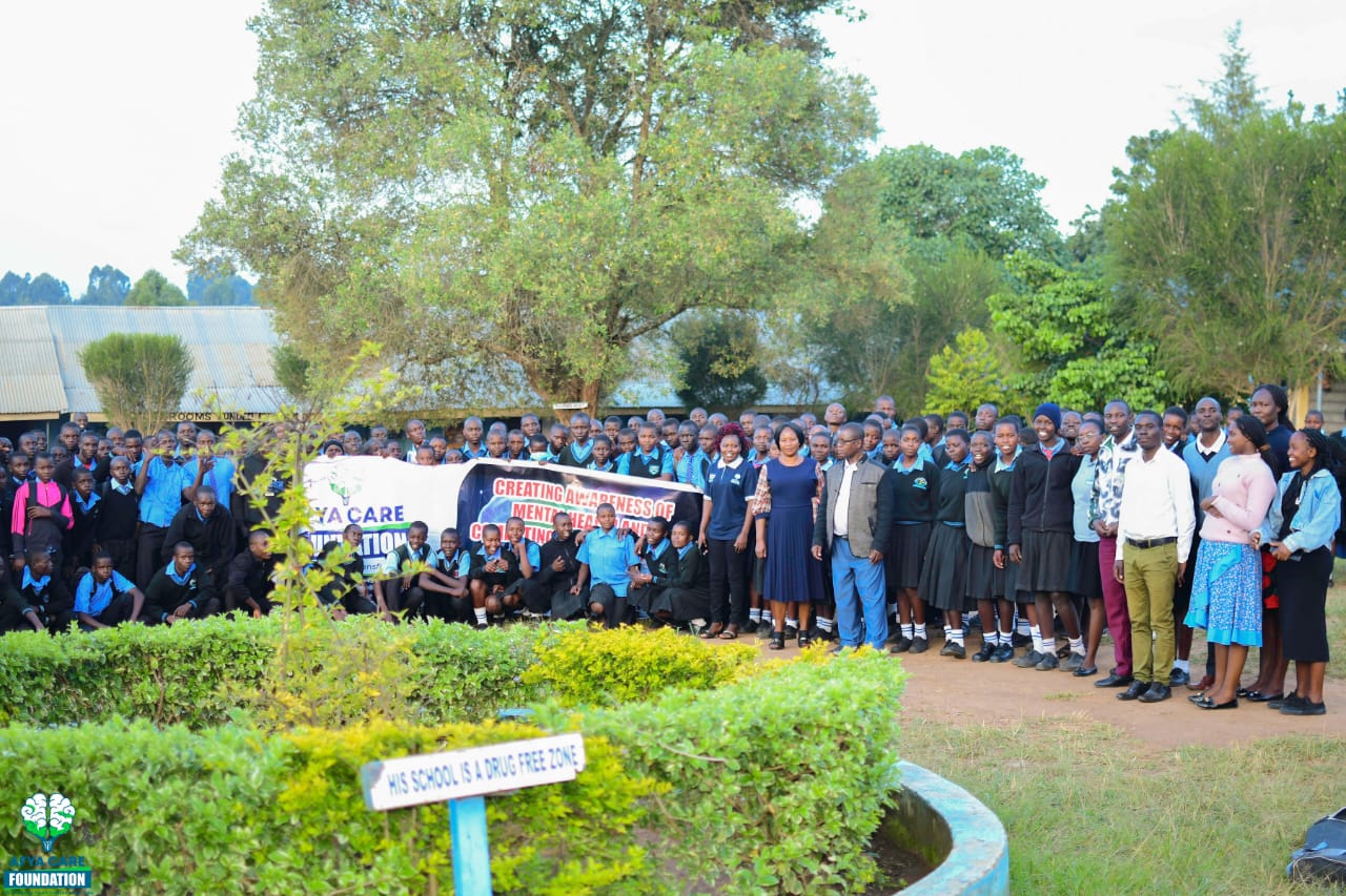Students seated in a school hall during an Afya Care Foundation outreach session