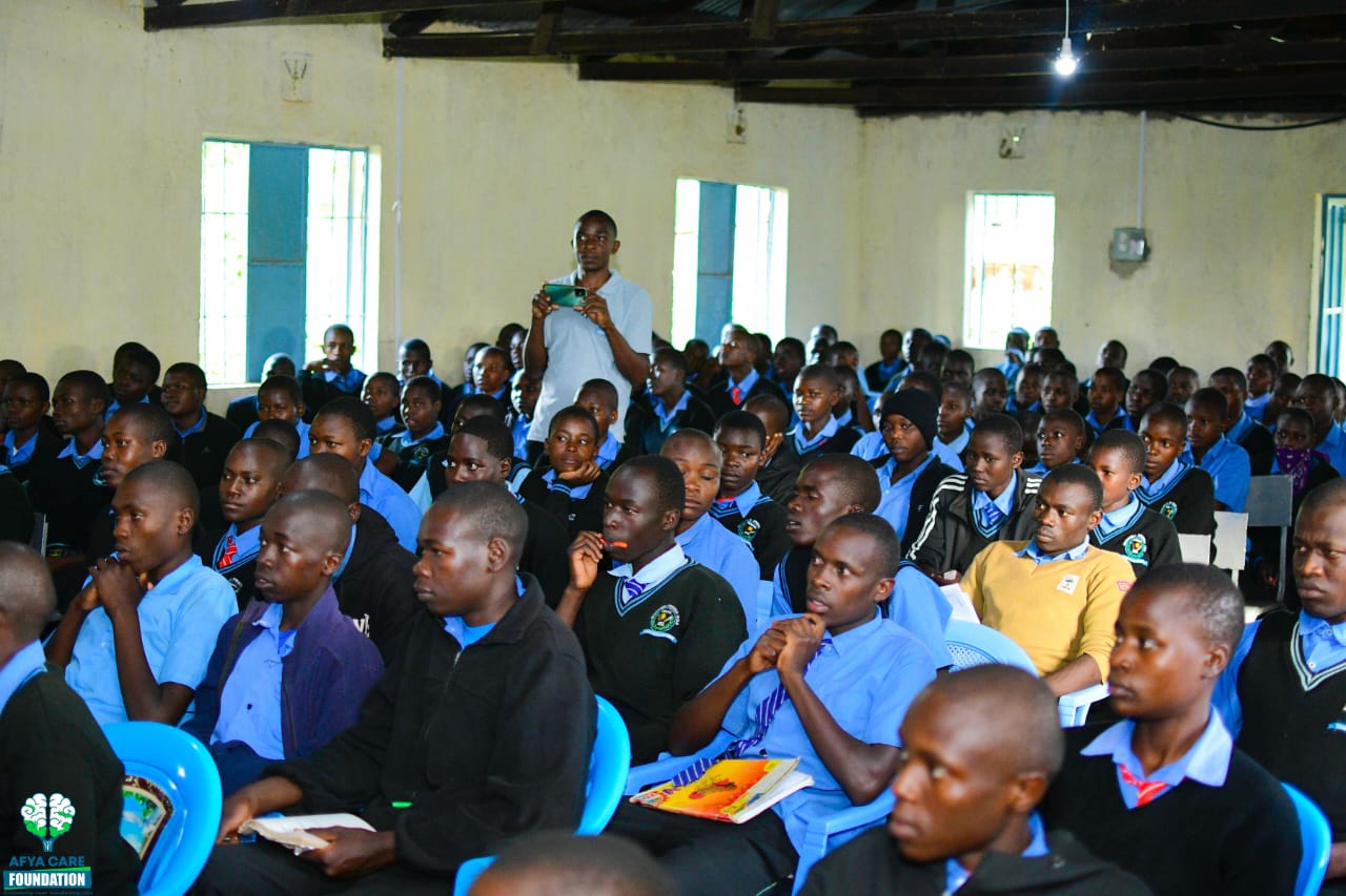 Afya Care Foundation facilitator speaking to students during a school outreach session